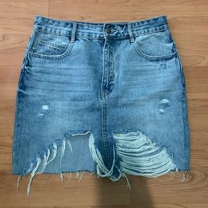 Distressed denim mini skirt